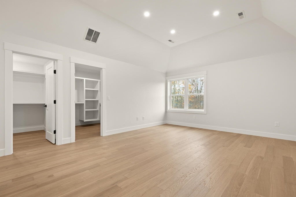 44 Buffington Street Attleboro, MA 02703 - Photo 26 of 41 a view of an empty room with a window and wooden floor