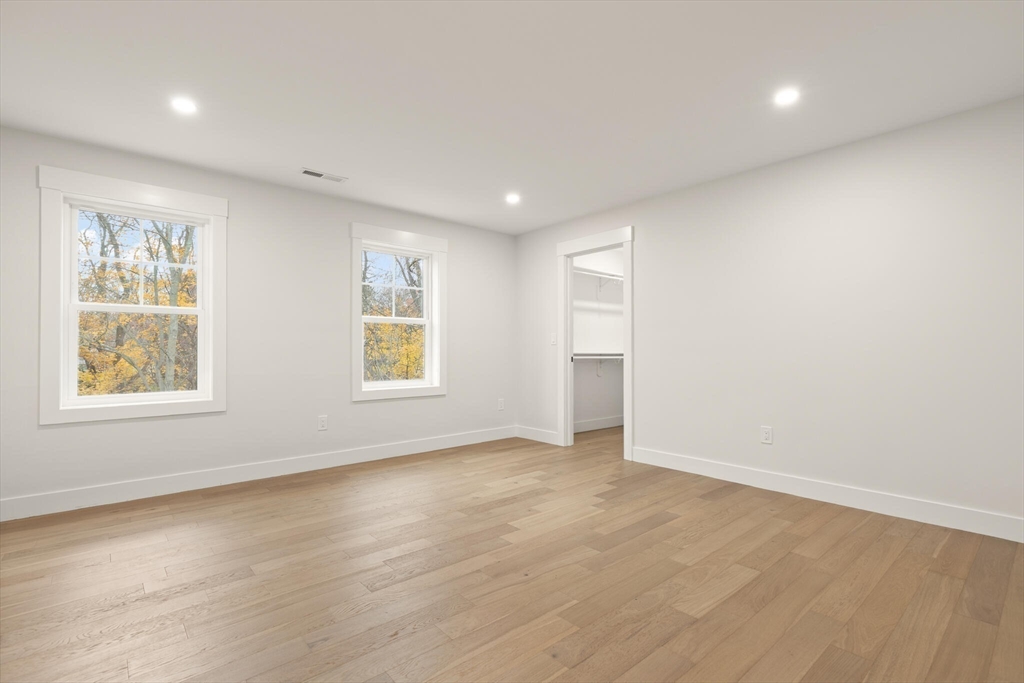44 Buffington Street Attleboro, MA 02703 - Photo 32 of 41 an empty room with wooden floor and windows
