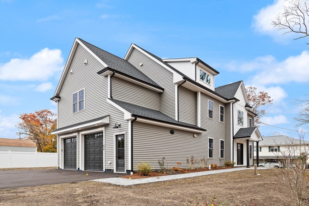 44 Buffington Street Attleboro, MA 02703 - Photo 41 of 41 a front view of a house with a road