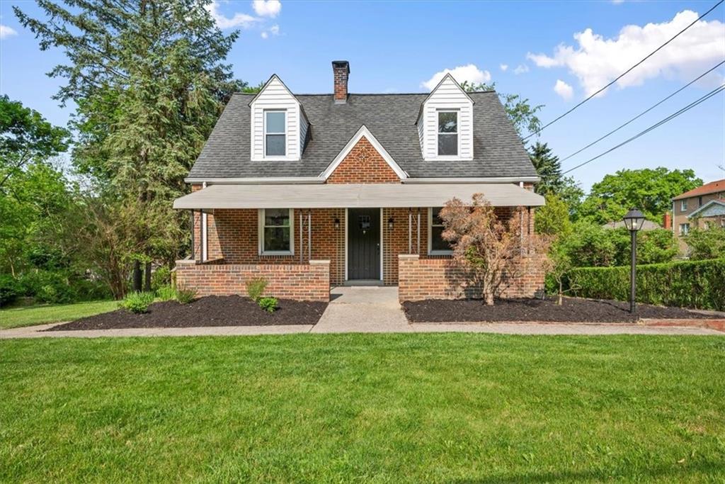 373 Goldsmith Road Pittsburgh, PA 15237 - Photo 1 of 40 a front view of a house with a yard and potted plants