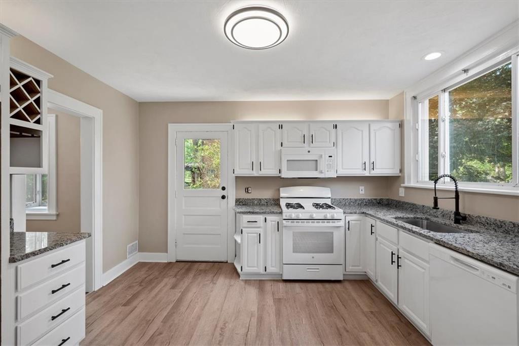373 Goldsmith Road Pittsburgh, PA 15237 - Photo 20 of 40 a kitchen with cabinets wooden floor and a sink