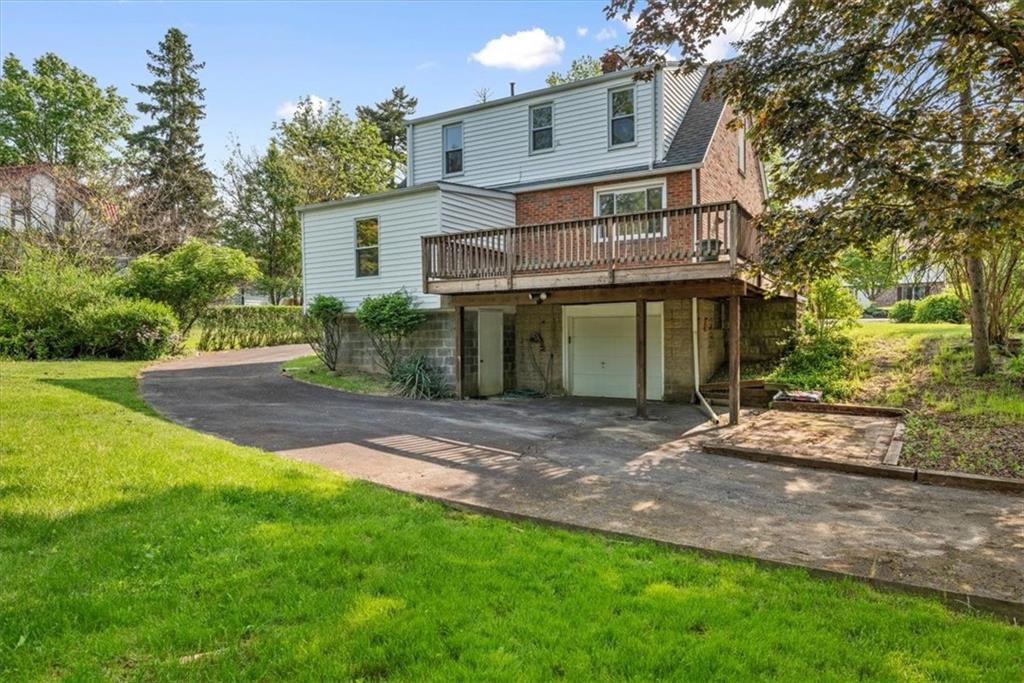 373 Goldsmith Road Pittsburgh, PA 15237 - Photo 35 of 40 a front view of a house with a garden and yard