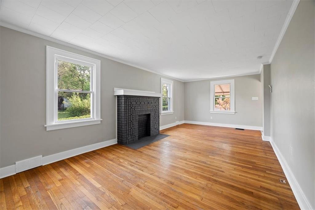 373 Goldsmith Road Pittsburgh, PA 15237 - Photo 10 of 40 an empty room with windows and fireplace