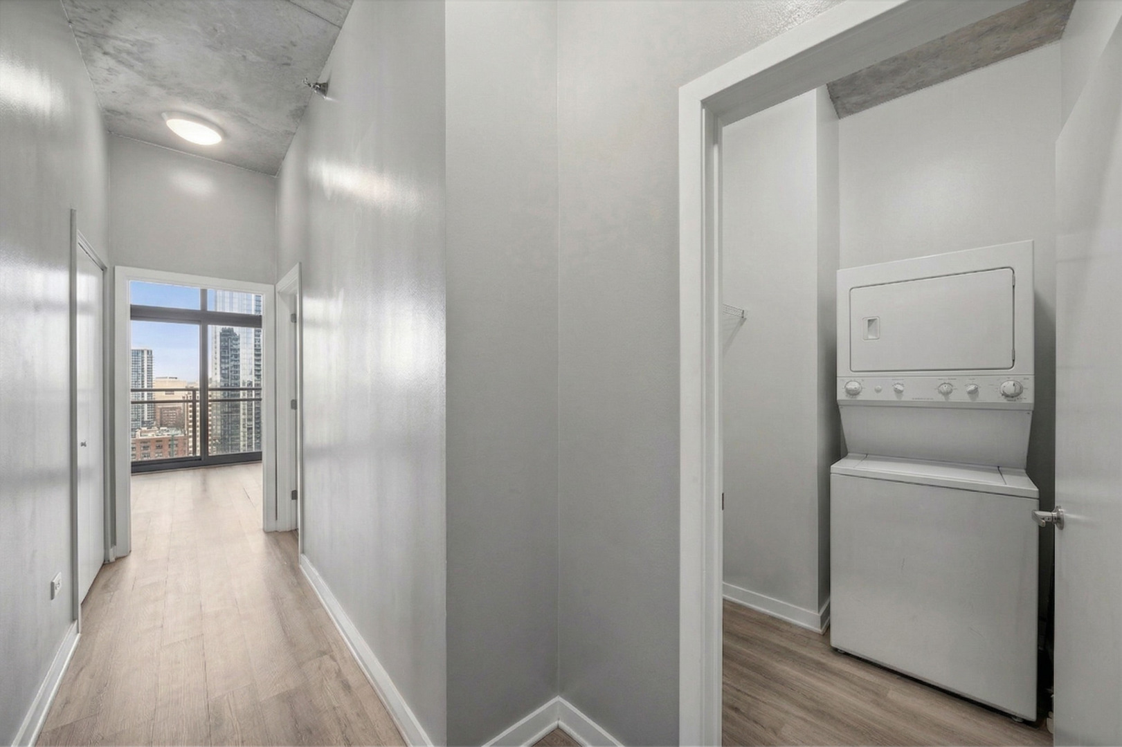 235 West Van Buren Street, Unit 2513 Chicago, IL 60607 - Photo 13 of 18 a view of a hallway with wooden floor