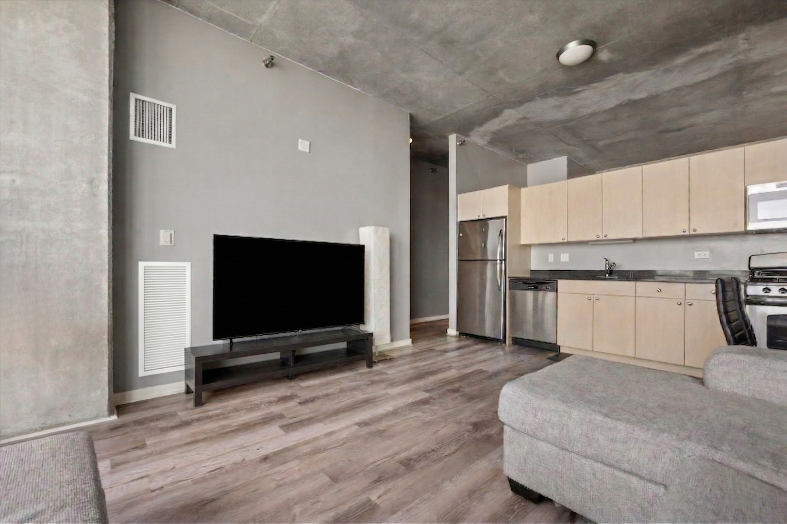 235 West Van Buren Street, Unit 2513 Chicago, IL 60607 - Photo 6 of 18 a view of kitchen with microwave and cabinets