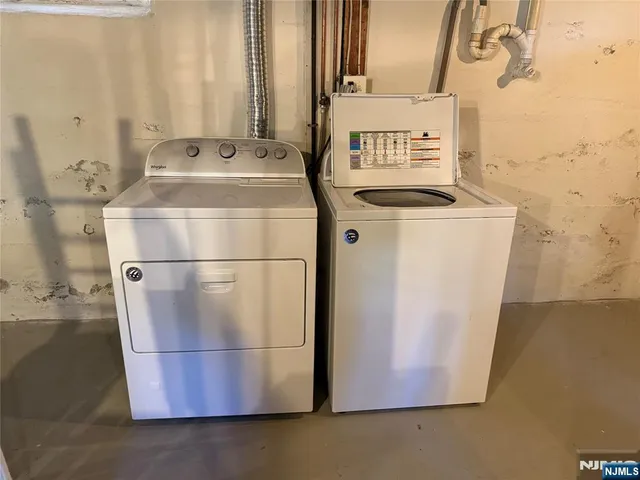 a view of a house with a yard and garage