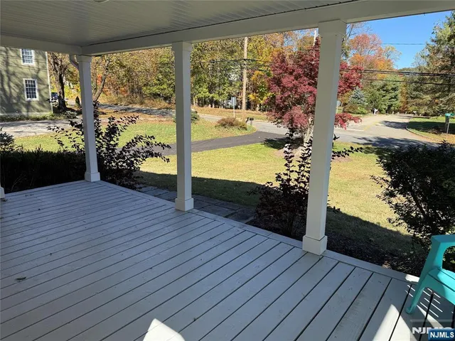 a view of a balcony with wooden floor