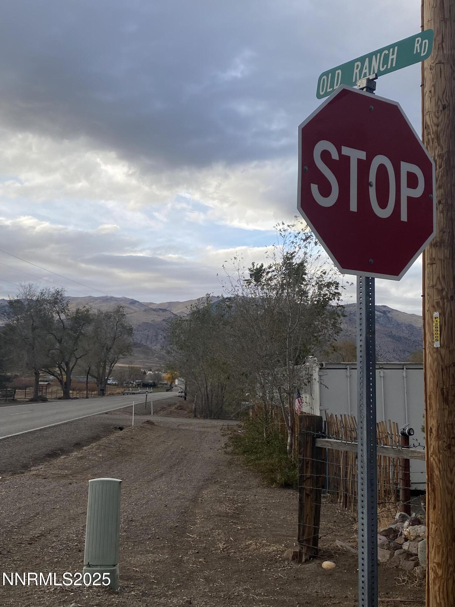 78 Old Ranch Road Smith Valley, NV 89430 - Photo 9 of 12 a view of a street with a barn in the background