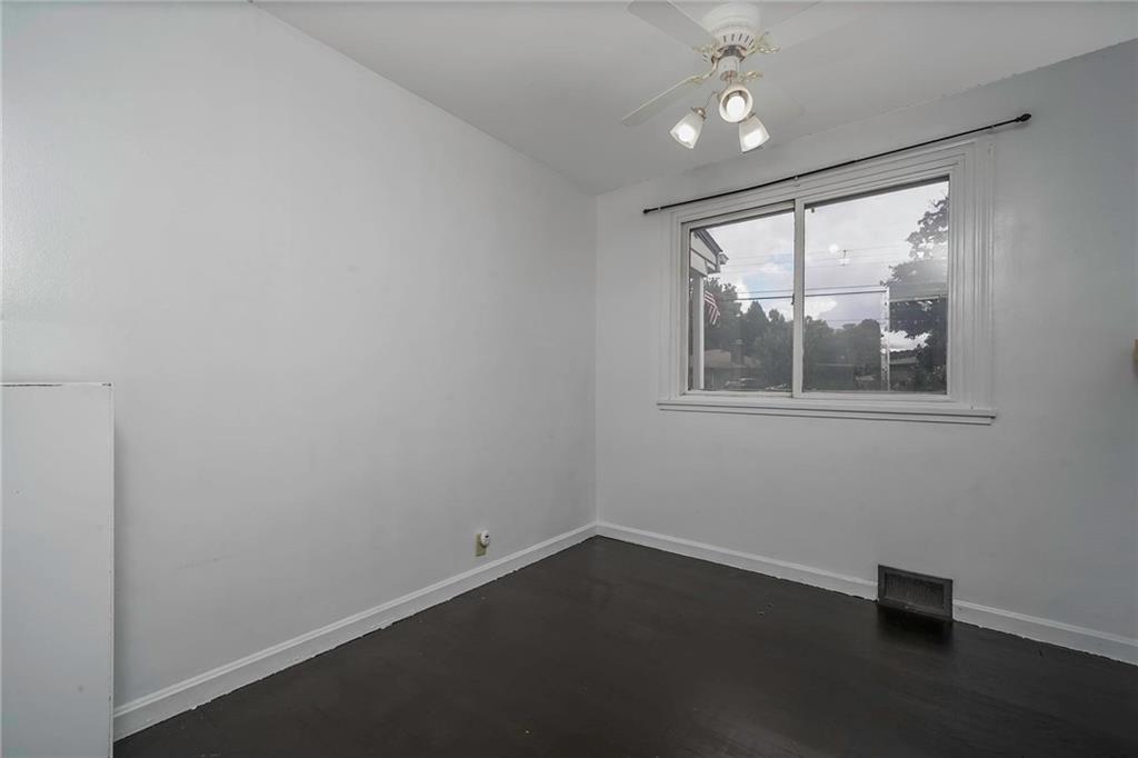 1073 Crest Drive Crescent, PA 15046 - Photo 18 of 33 an empty room with wooden floor and windows
