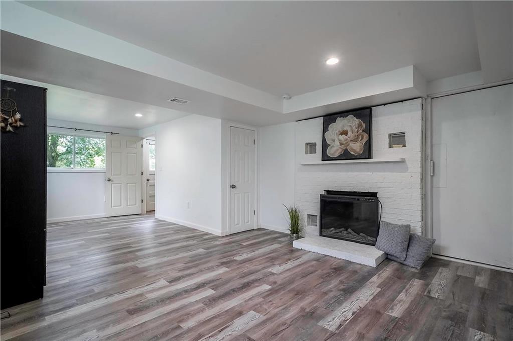 1073 Crest Drive Crescent, PA 15046 - Photo 21 of 33 a view of empty room with wooden floor and fireplace