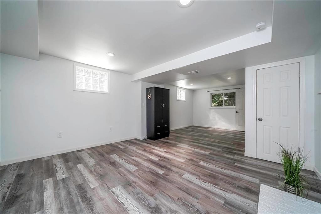 1073 Crest Drive Crescent, PA 15046 - Photo 22 of 33 a view of an empty room with wooden floor and a window