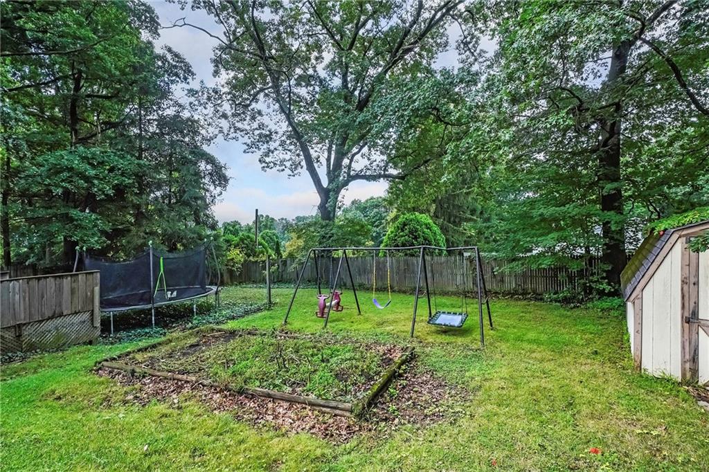 1073 Crest Drive Crescent, PA 15046 - Photo 32 of 33 a view of a backyard with a swing