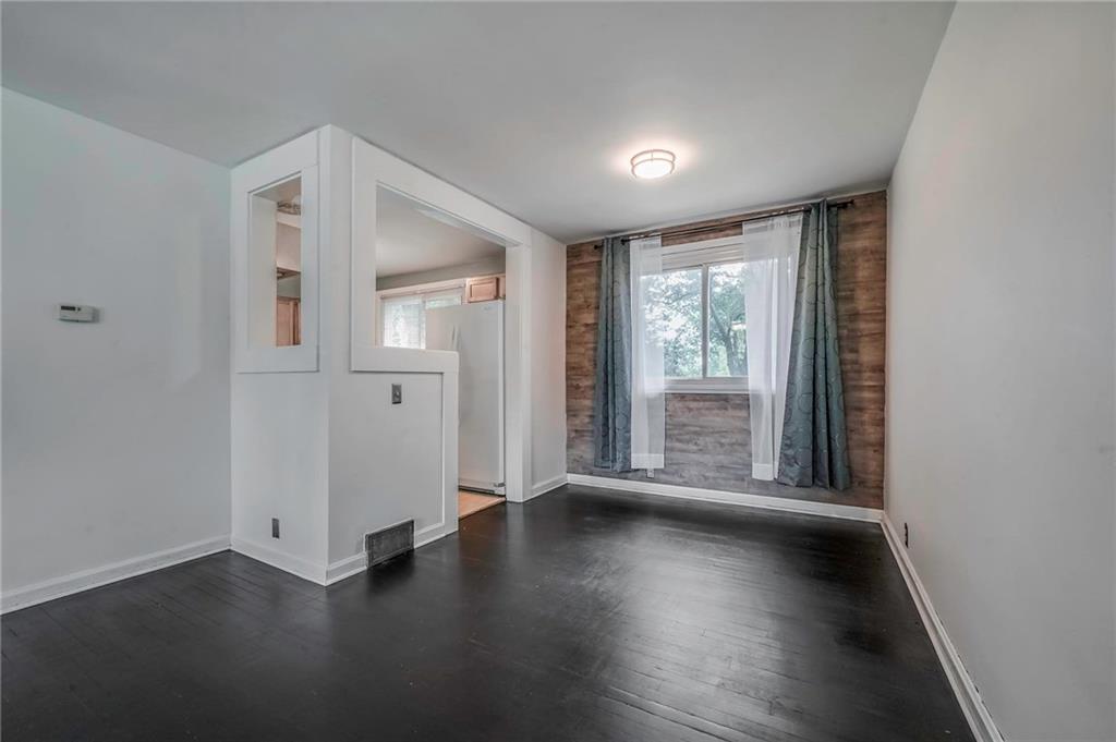 1073 Crest Drive Crescent, PA 15046 - Photo 4 of 33 an empty room with wooden floor and windows