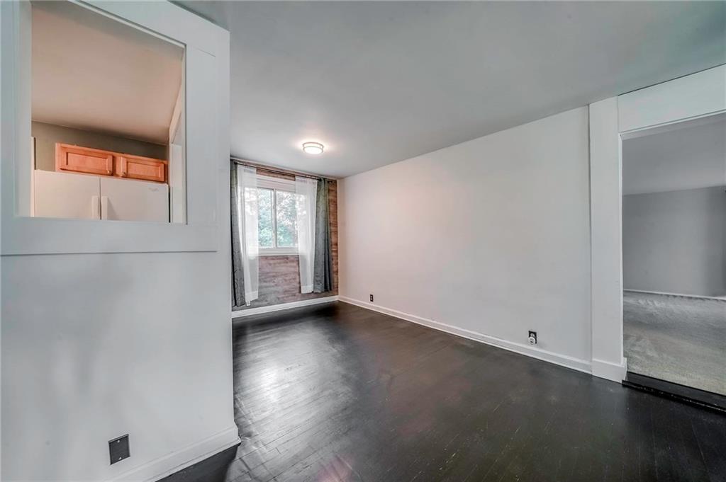 1073 Crest Drive Crescent, PA 15046 - Photo 5 of 33 an empty room with wooden floor and windows