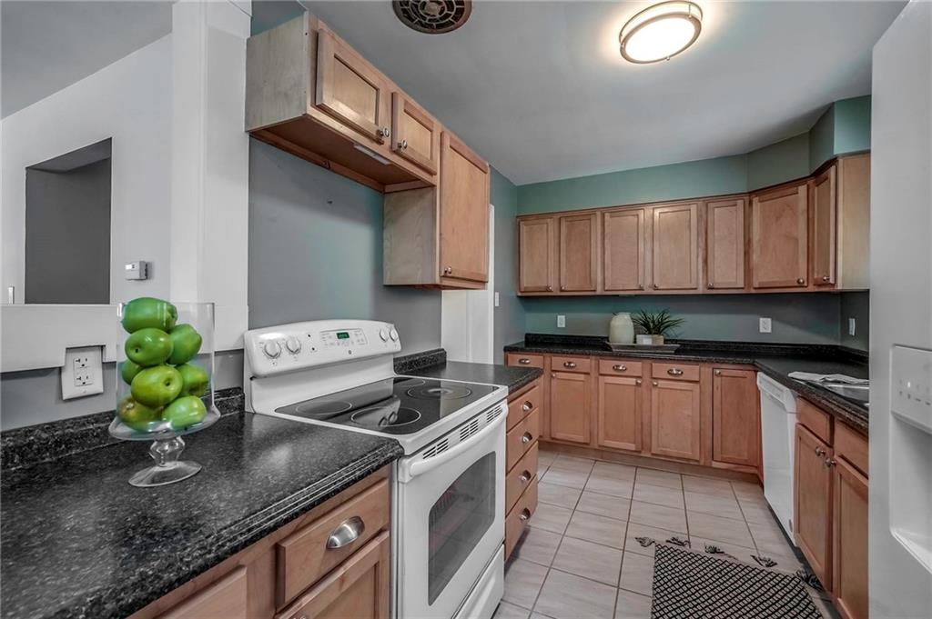 1073 Crest Drive Crescent, PA 15046 - Photo 10 of 33 a kitchen with stainless steel appliances granite countertop a sink a stove and a microwave