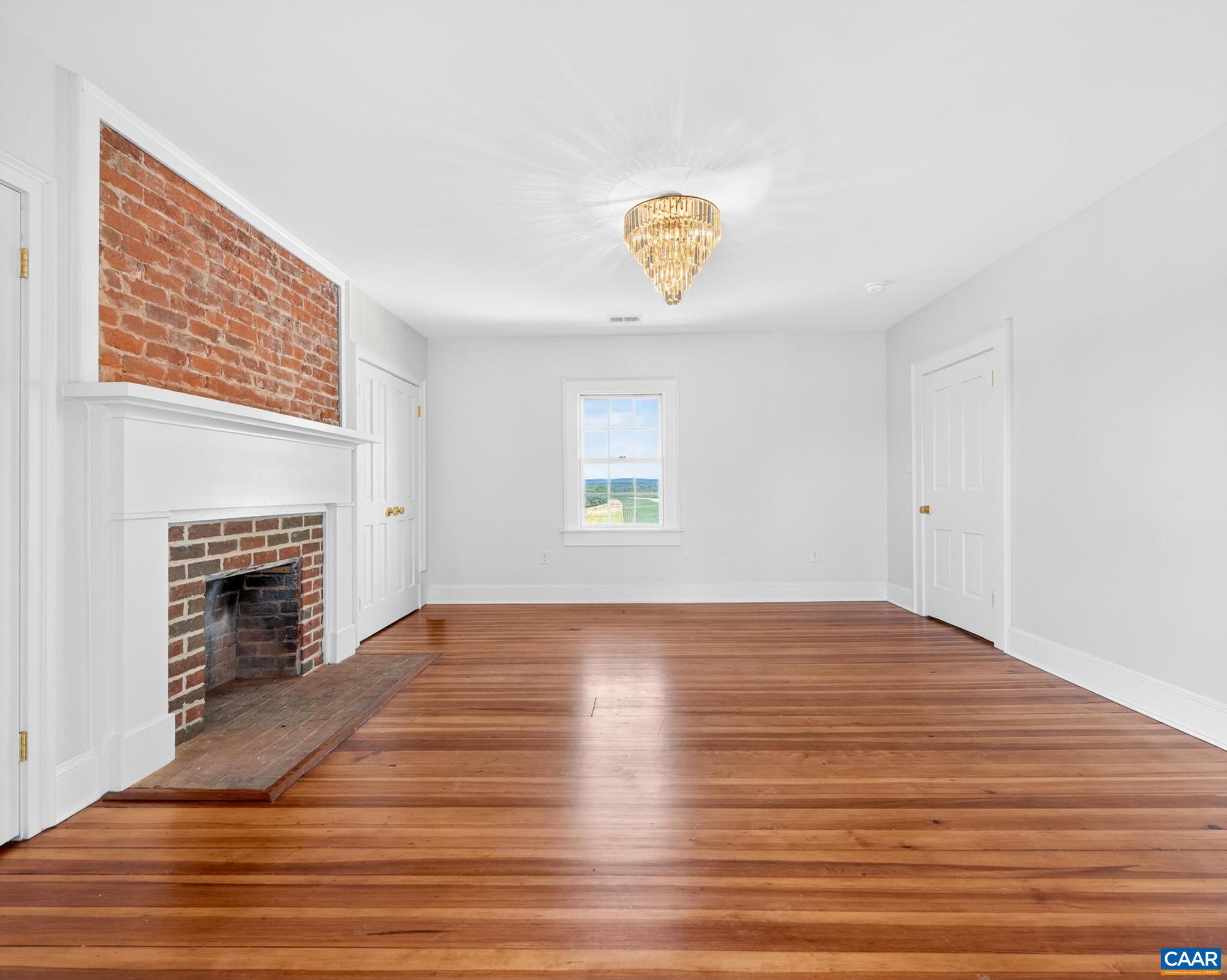 481 Race Ground Road Somerset, VA 22972 - Photo 21 of 53 a view of empty room with wooden floor and fireplace