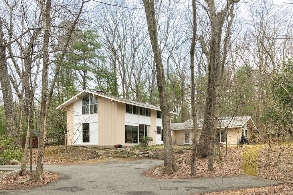 31 Turning Mill Road Lexington, MA 02420 - Photo 1 of 32 a white house that has a tree in front of it