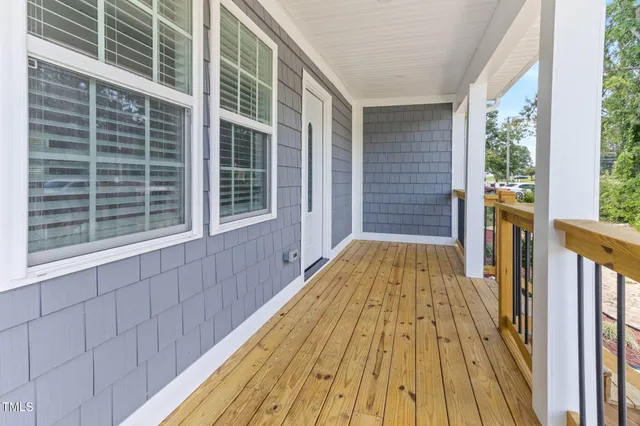 a view of wooden balcony with a outdoor space