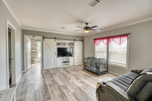 a view of a hallway with washer and dryer