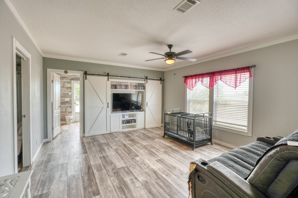 101 Samuel Drive Bertram, TX 78605 - Photo 14 of 30 a living room with furniture and a flat screen tv