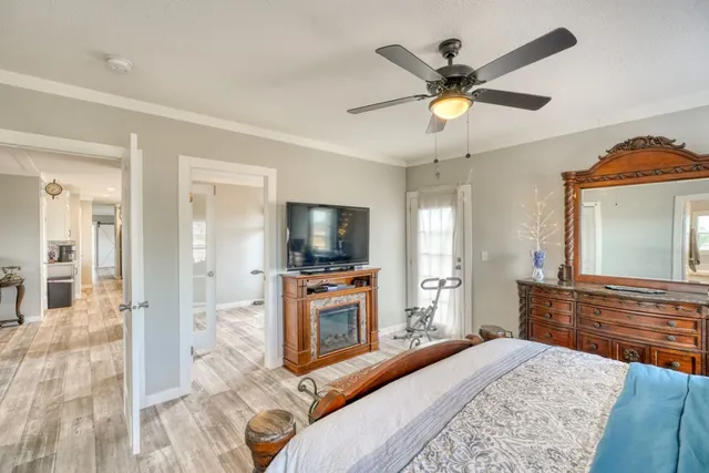 a white bath tub sitting in a bathroom next to a window