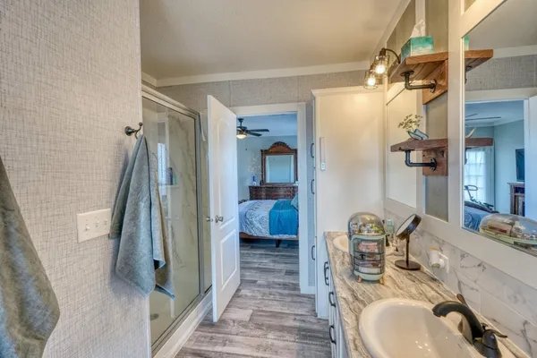 a view of walk in closet with clothes
