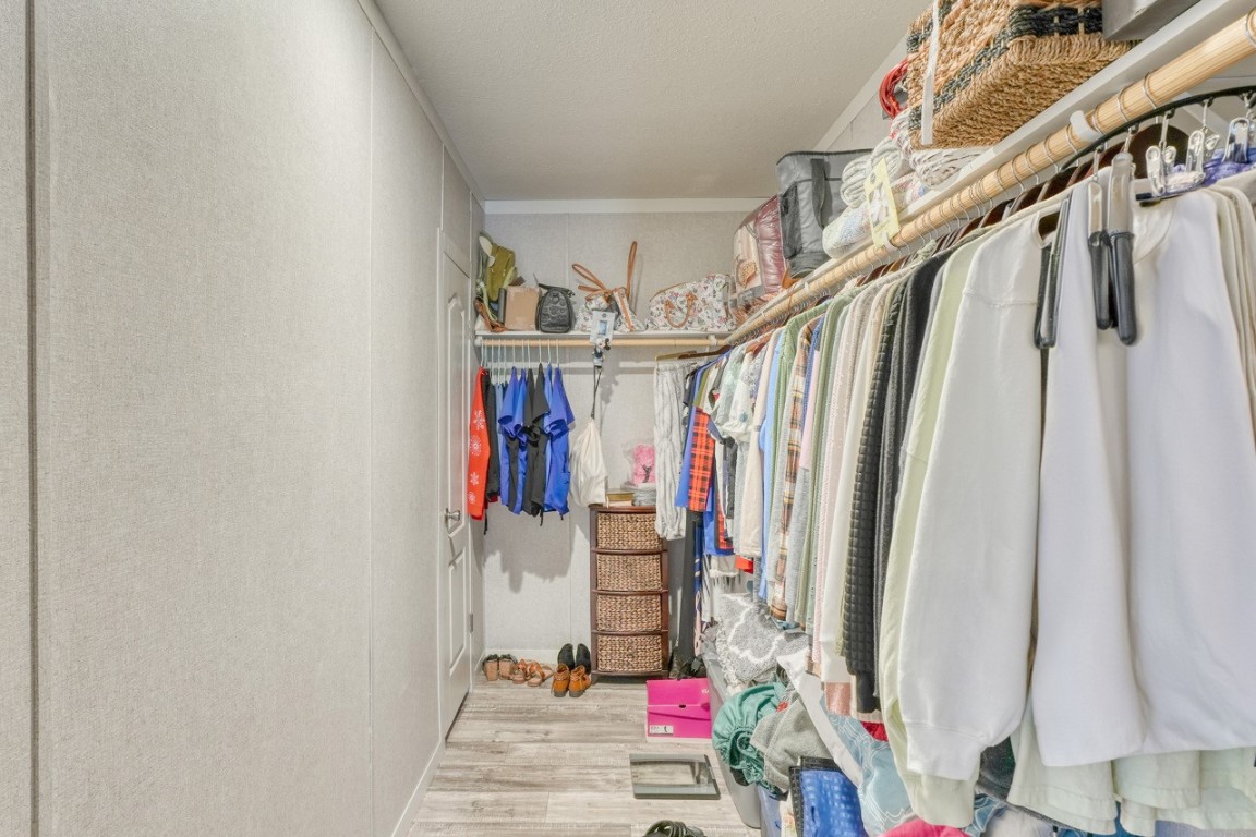 101 Samuel Drive Bertram, TX 78605 - Photo 25 of 30 a view of walk in closet with clothes