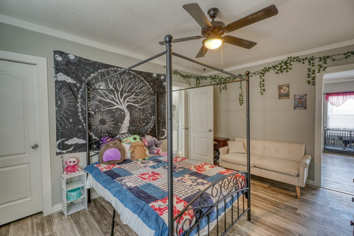 101 Samuel Drive Bertram, TX 78605 - Photo 28 of 30 a bedroom with a bed a table and chair