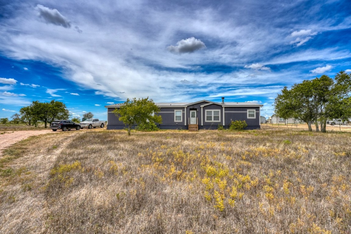 101 Samuel Drive Bertram, TX 78605 - Photo 4 of 30 a front view of a house with a yard