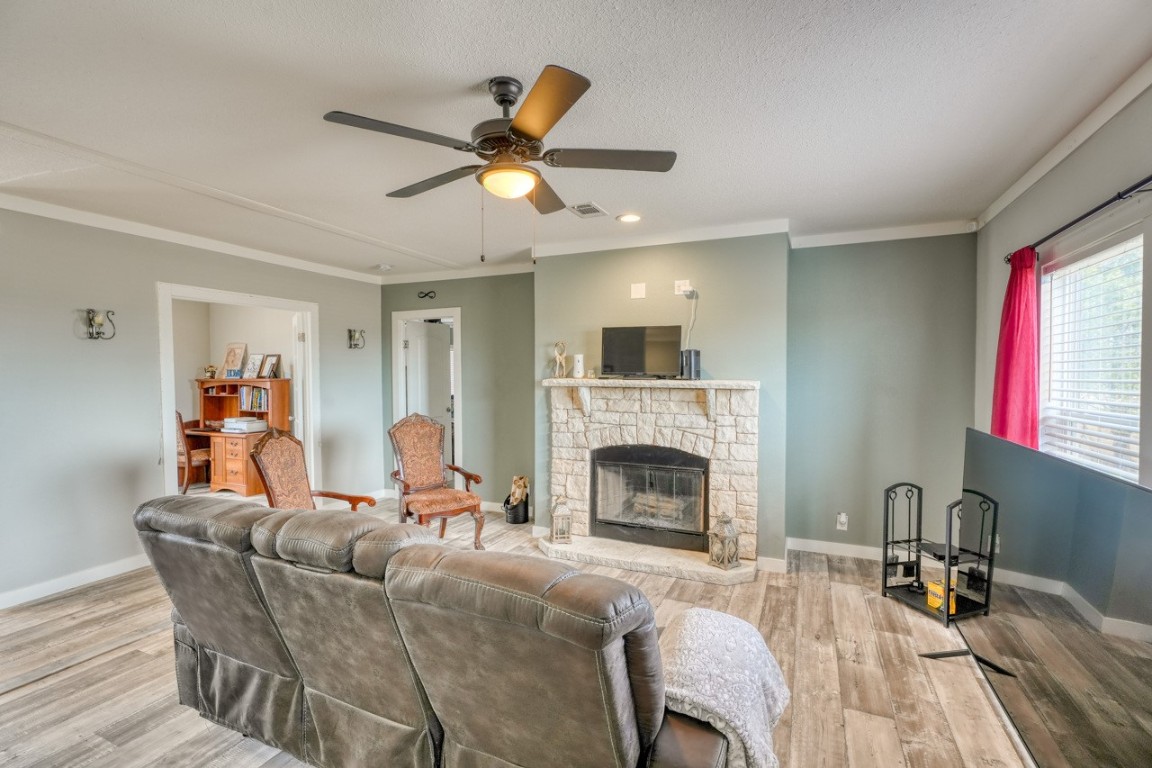 101 Samuel Drive Bertram, TX 78605 - Photo 8 of 30 a living room with furniture and a fireplace