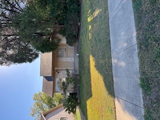 307 West William Cannon Drive, Unit A Austin, TX 78745 - Photo 2 of 14 a view of a yard in front of house