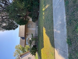 307 West William Cannon Drive, Unit A Austin, TX 78745 - Photo 3 of 14 a view of a house with a yard and a large tree