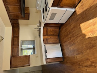 307 West William Cannon Drive, Unit A Austin, TX 78745 - Photo 5 of 14 a kitchen with granite countertop a sink and a stove