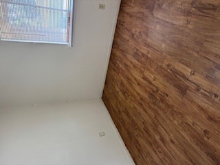 307 West William Cannon Drive, Unit A Austin, TX 78745 - Photo 10 of 14 a view of empty room with wooden floor and fan