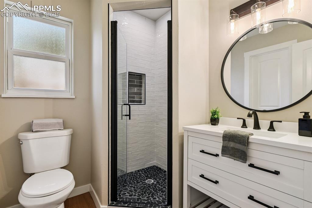 79 Old Broadmoor Road Colorado Springs, CO 80906 - Photo 23 of 27 Full bath featuring vanity and a stall shower