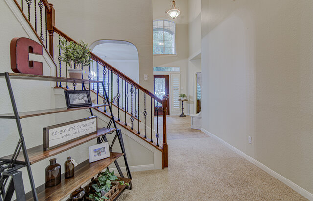 507 Rummel Ranch Run Cedar Park, TX 78613 - Photo 9 of 39 A grand entryway greets guests with an elegant staircase and soaring ceilings.