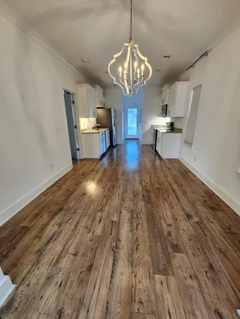 a view of a dining room with wooden floor
