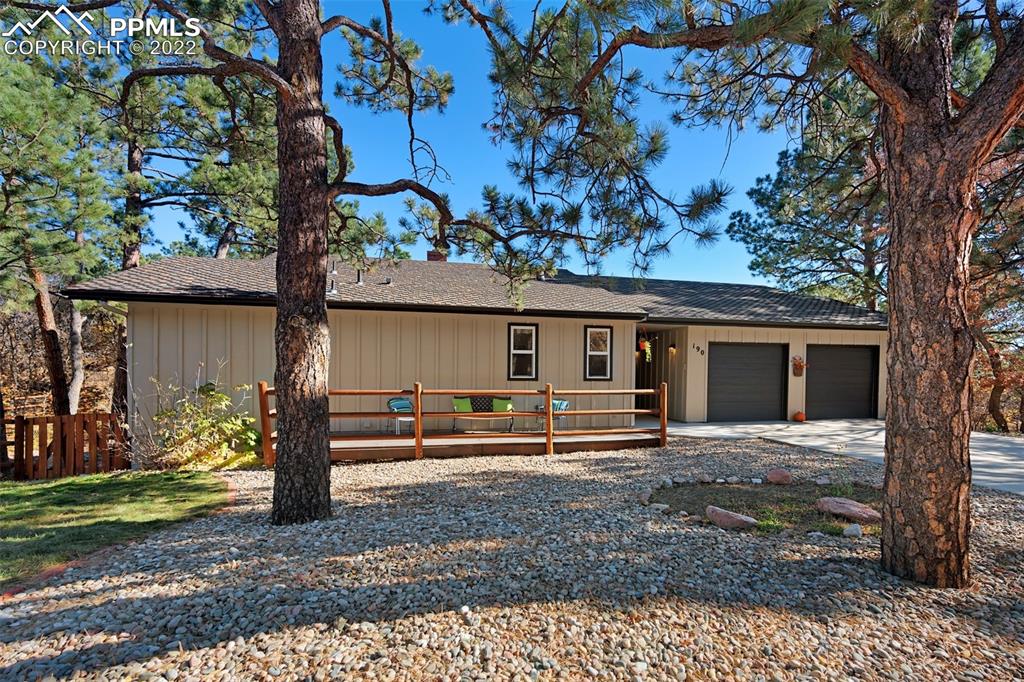 Welcome home to this private setting in the trees or Rockrimmon.