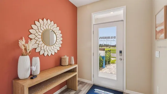 a room with a table and a potted plant