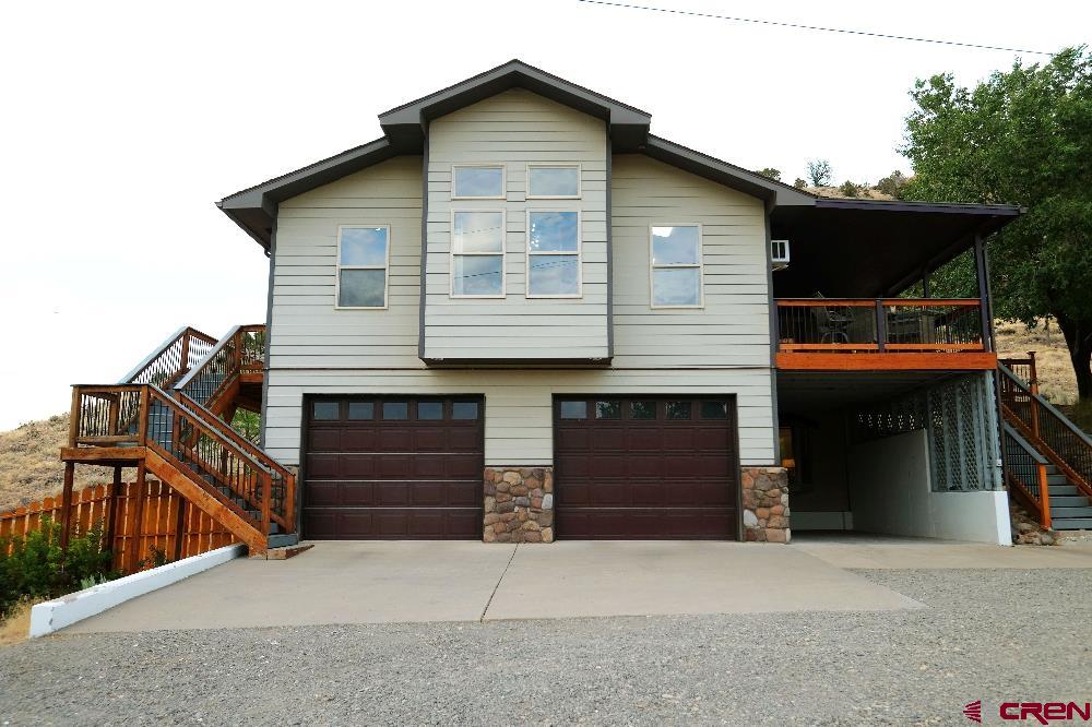 14135 N73 Road Montrose, CO 81401 - Photo 2 of 29 a front view of house