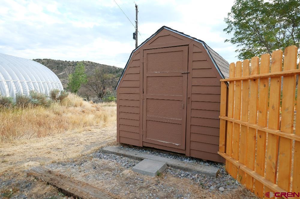 14135 N73 Road Montrose, CO 81401 - Photo 27 of 29 a backyard of a house