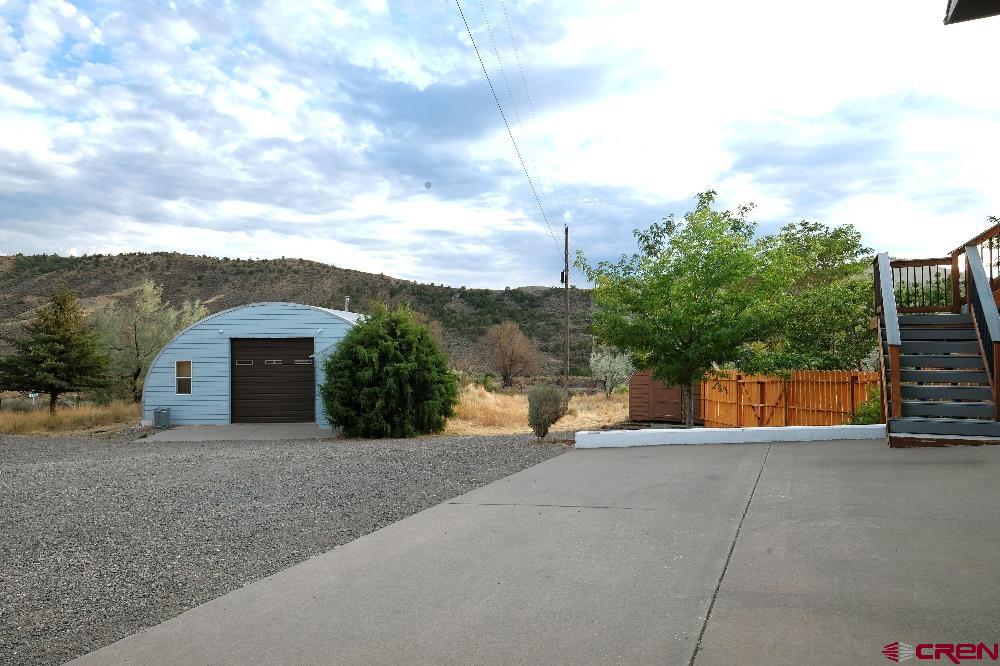 14135 N73 Road Montrose, CO 81401 - Photo 3 of 29 a view of a house with a backyard