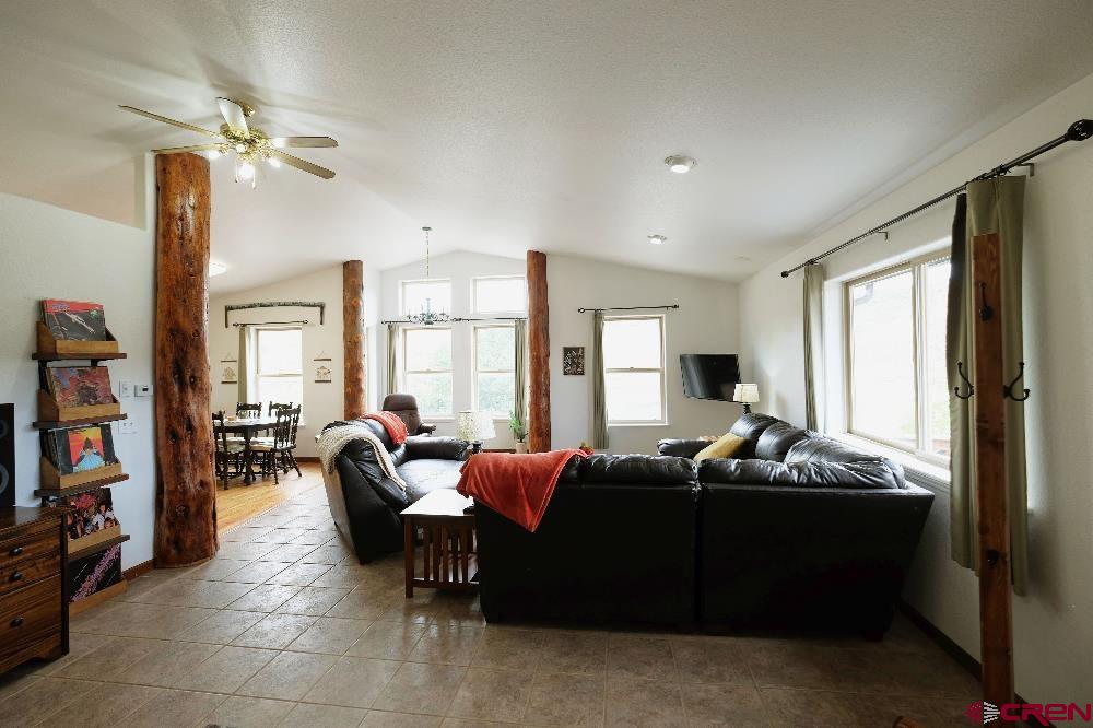 14135 N73 Road Montrose, CO 81401 - Photo 4 of 29 a living room with furniture and a large window