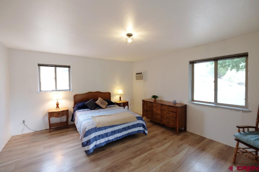 14135 N73 Road Montrose, CO 81401 - Photo 10 of 29 a bedroom with a bed and a window