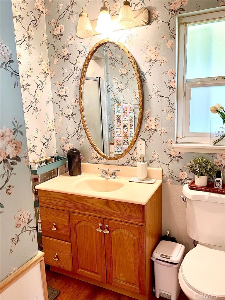 1640 Celeste Court Merced, CA 95341 - Photo 15 of 19 a bathroom with a sink mirror vanity and toilet