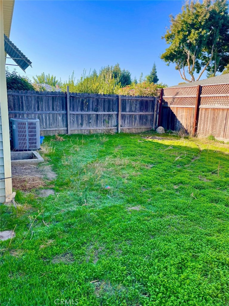 1640 Celeste Court Merced, CA 95341 - Photo 18 of 19 a view of yard with green space and wooden fence