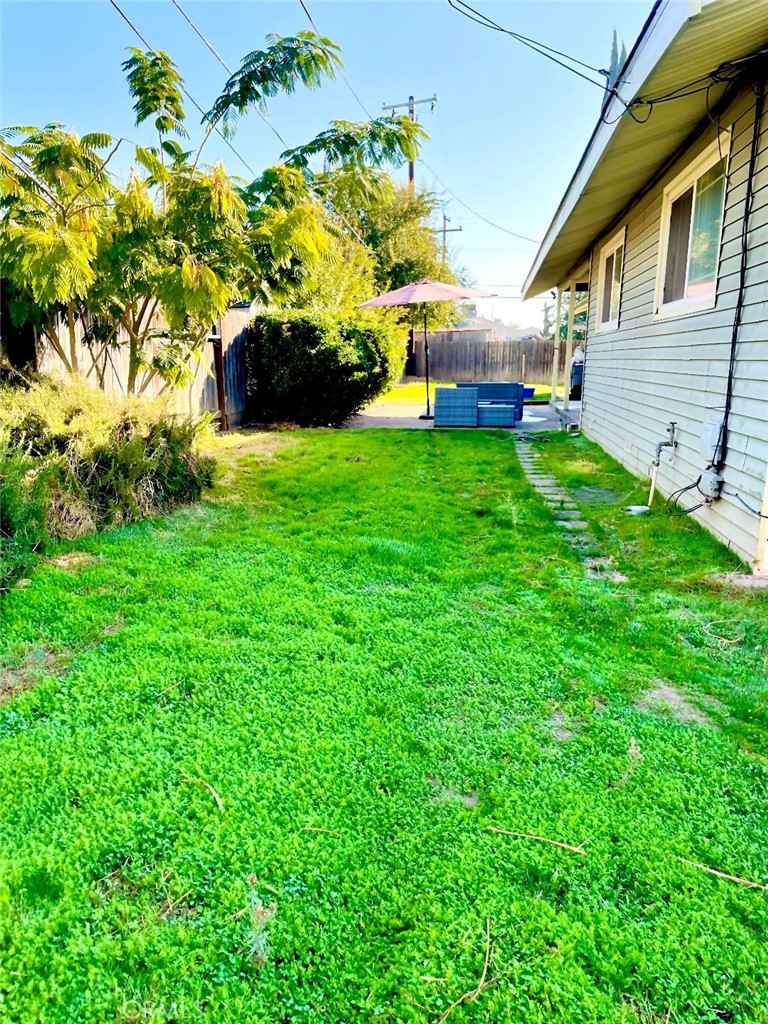 1640 Celeste Court Merced, CA 95341 - Photo 19 of 19 a view of a house with a yard and garden
