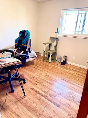 a white toilet sitting next to a bathroom sink and a shower curtain