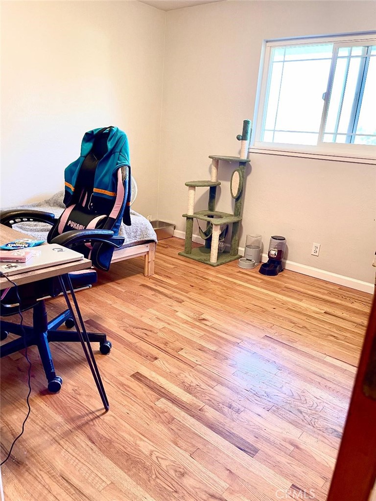 1640 Celeste Court Merced, CA 95341 - Photo 10 of 19 a workspace with furniture and wooden floor