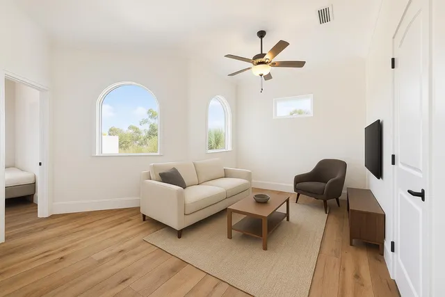 a living room with furniture and a window